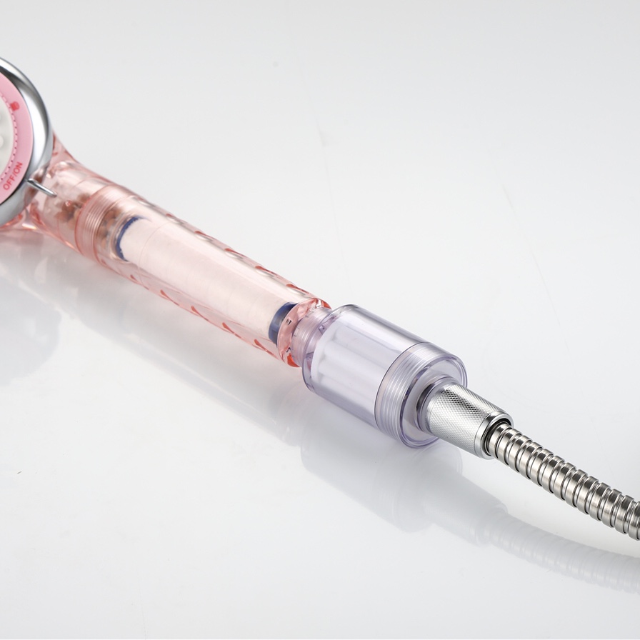 PP Filter-2 white PP cotton filter cartridge inside a transparent pink shower handle with inline clear filter